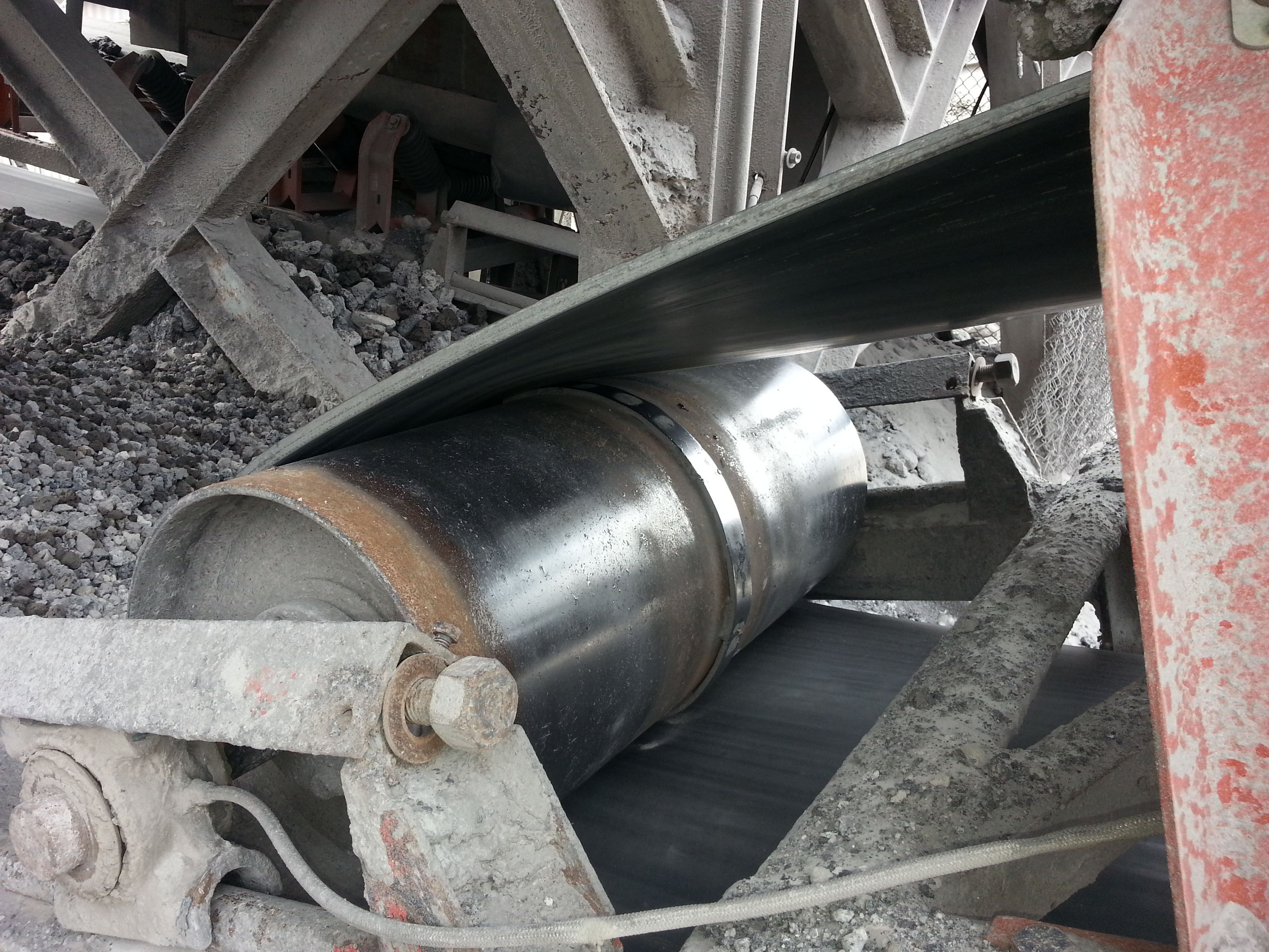 Conveyor belt wrapped around tail pulley.