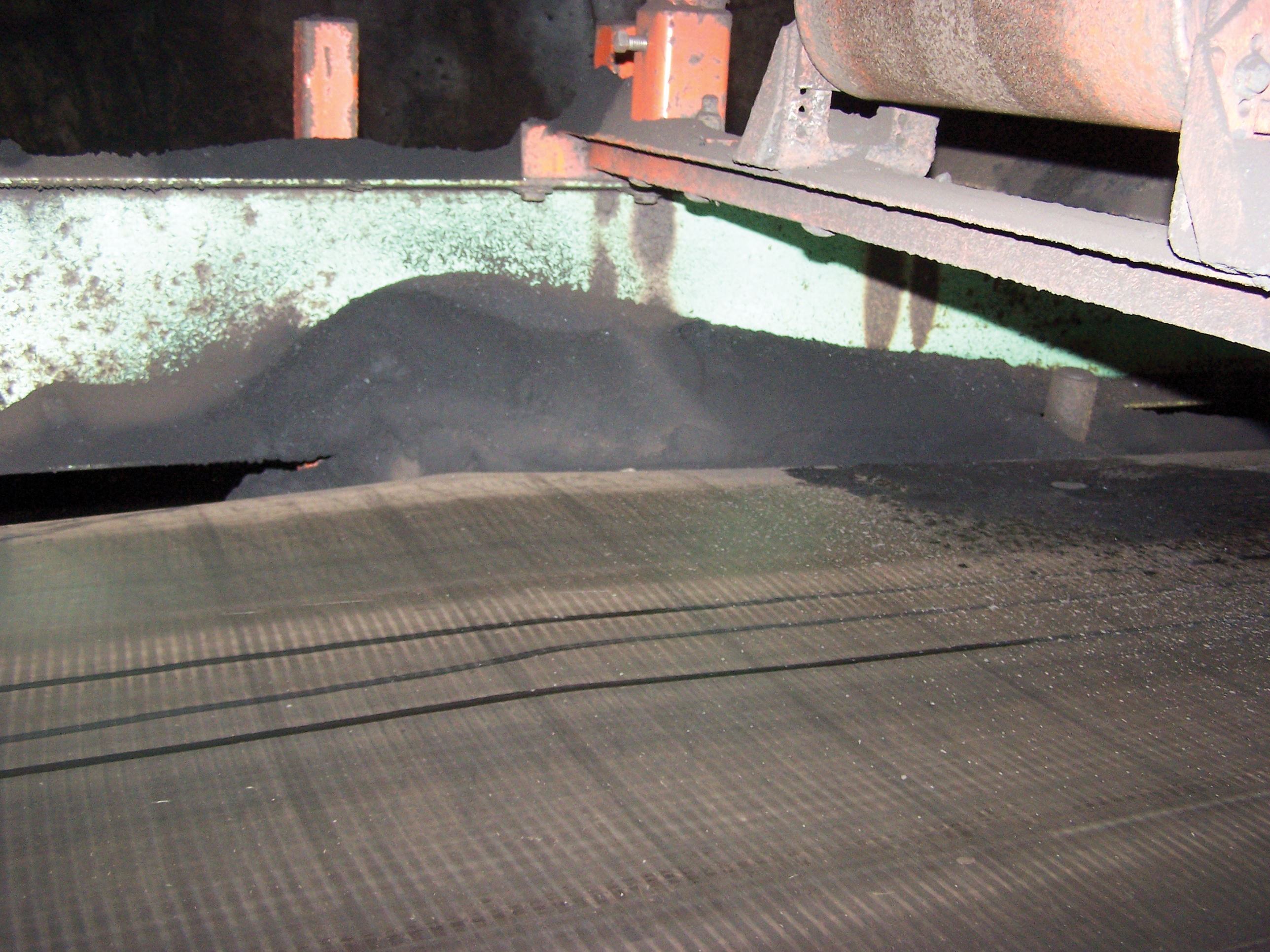 Conveyor belt surface damage caused by belt cleaner chatter.