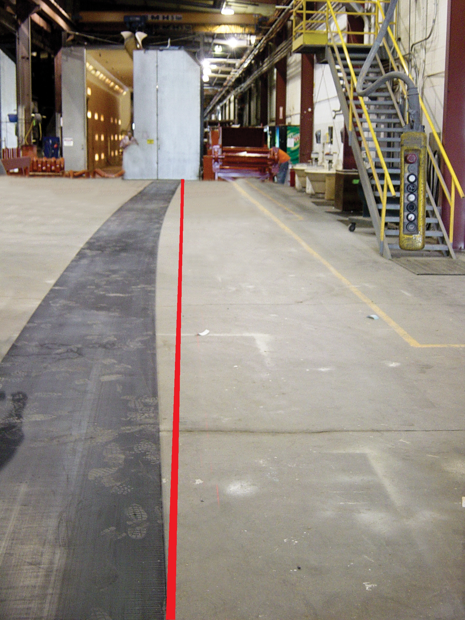 Conveyor belt laid flat to show its camber.