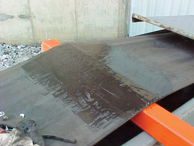 A close-up view of the conveyor belt shows the fasteners have been recessed into the belt top cover.