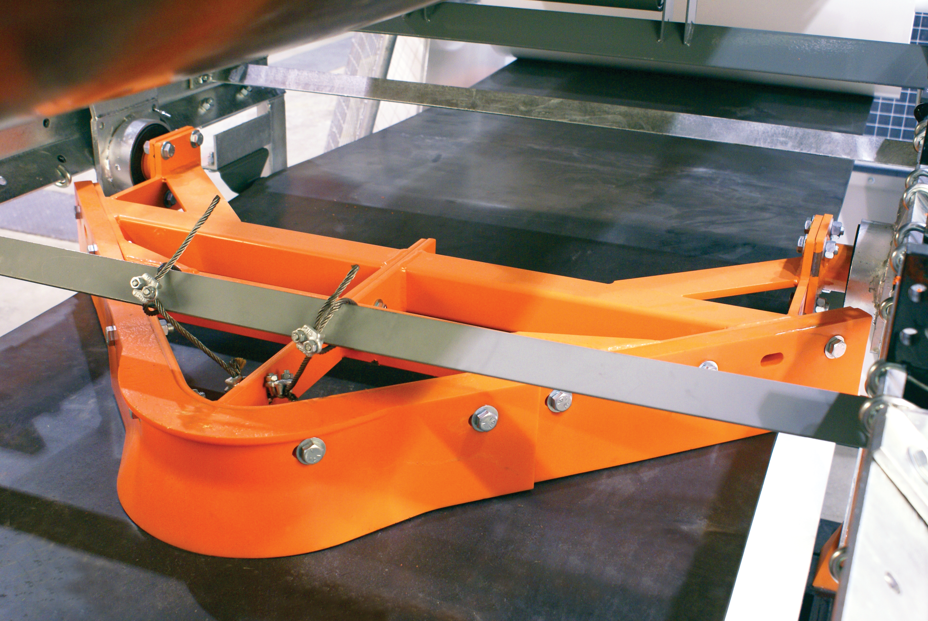 Pulley protection plow installed on a conveyor belt.