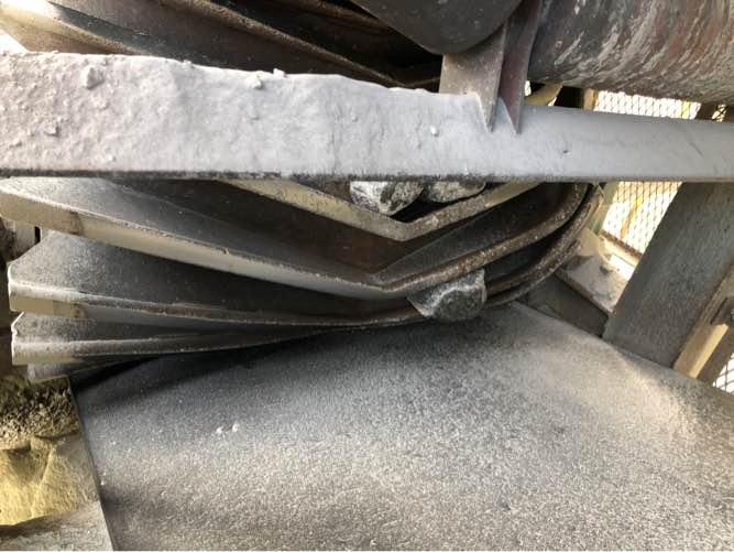 Material in a tail pulley present significant risk of damage to the conveyor belt.